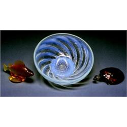 A lalique Coloured Glass Mascot, French, c.1970, signed Lalique., The yellow glass figure realis...