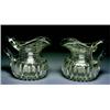 Image 1 : A pair of Georgian Glass Water Jugs, Irish, c.1820, The bulbous loebed bodies and heavy strap ha...