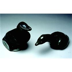 Unidentified, Povungnituk, c.1970, The large black stone model of a sea bird perched on a rock w...