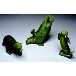 Jutani Parr, Cape Dorsett, recent, signed, The emerald green stone carving of a grimacing polar...
