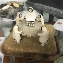 INUIT BONE CARVING, SURROUNDING A TRAMPOLINE ON SEAL SKIN BASE 4  X 4 