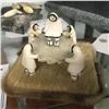 Image 1 : INUIT BONE CARVING, SURROUNDING A TRAMPOLINE ON SEAL SKIN BASE 4" X 4"