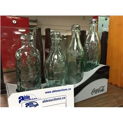 LOT OF 4 VINTAGE COCA-COLA BOTTLES WITH DISPLAY STAND