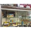 Image 1 : SHELF LOT OF COLLECTABLES INCL. TIN WIND UP HORSE RACE, STAR TREK TRACER GUN, PLANET OF THE APES