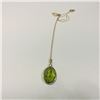 Image 1 : ONE 14KT YELLOW GOLD NATURAL PERIDOT AND DIAMOND SET PENDANT. 1 OVAL MIXED CUT NATURAL PERIDOT,