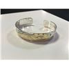 Image 1 : ONE HAND MADE 14K YELLOW GOLD AND STERLING SILVER FIRST NATIONS 1/2" BANGLE STYLE BRACELET. HAND