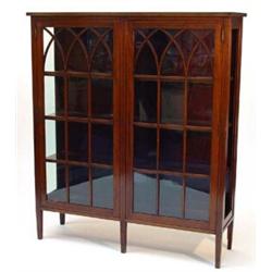 Edwardian inlaid mahogany bookcase, fitted a pair of gothic arched glazed doors enclosing four sh…