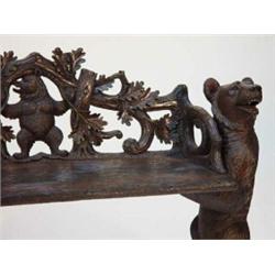 Black Forest carved wooden bench with a pair of well detailed bears holding the bench and the bac…