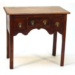 19th century oak lowboy, fitted three frieze drawers above a shaped apron on champfered square le…