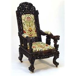 Anglo Chinese carved rosewood chair, profusely carved all over with serpents and dragons on claw …