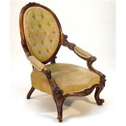 Victorian carved walnut spoonback armchair with button upholstery on scrolling floral carved legs…