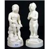 Image 1 : Two Parian figures of scantily clad cherubs on circular bases, 26cm high…