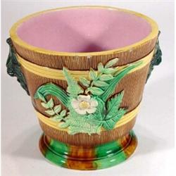 Victorian Majolica jardiniere decorated with sprays of flowers and lion masks in yellows, greens …