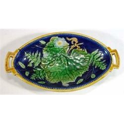 Victorian Majolica twin handled floral dish, decorated in blues, greens and beiges, 25cm in diame…