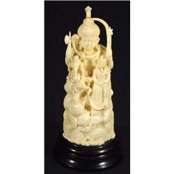 Carved ivory Indian Goddess figure and circular ebonised stand, 17cm high…