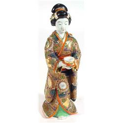 Hand painted Satsuma pottery figurine of a Geisha girl clutching a bowl, 33cm high…