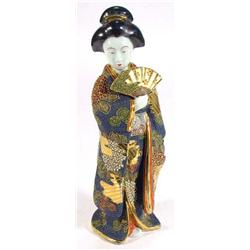 Hand painted Satsuma pottery figurine of a Geisha girl clutching a fan, 33cm high…