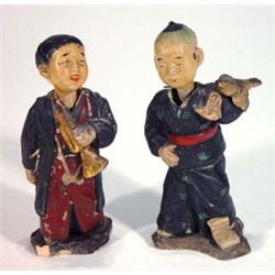 Two hand painted terracotta oriental boy nodders, 16cm high…