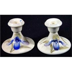 Pair of Moorcroft candlesticks, hand decorated with orchids, 10cm high, marks to base…