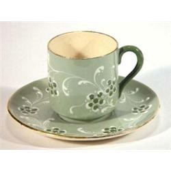 Moorcroft McIntyre Gesso faience coffee can and saucer, decorated with green flowers…