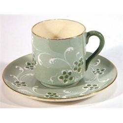 Moorcroft McIntyre Gesso faience coffee can and saucer, decorated with green flowers…