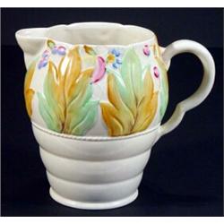 Hand painted Clarice Cliff jug, decorated with band of leaves and berries, 20cm high, marks to ba…