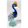 Image 1 : Murano colourful glass bird on clear pedestal, 27cm high, paper label to front…