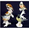 Image 1 : Selection of four hand painted Continental porcelain birds on branches, tallest 22cm high…