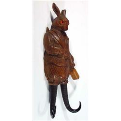 Carved Black Forest rabbit huntsman wooden coathook, 36cm in length…