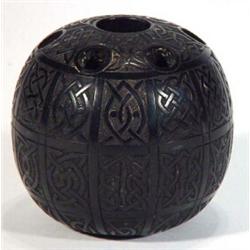 Irish bog oak sphere decorated with panels of knots, 9cm high…