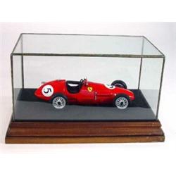 Tonka Ferrari 500 model in a glazed display case on a wooden stand and ephemera…