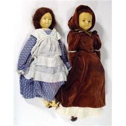 Two dolls with hand painted pottery heads, feet and arms, in Edwardian dress…