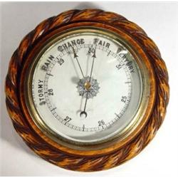 Circular oak rope twist edged barometer with enamel dial, 20cm diameter…