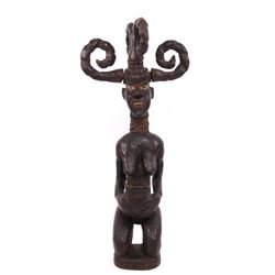 African wood carved figure with curled horns, 19th
