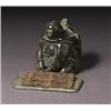 Image 1 : attributed to alacie alashuk, Povungnituk., Black stone carving of a mother carrying a child in...