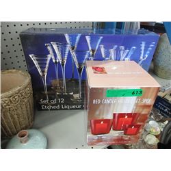 Boxed set of glassware & red candle holders
