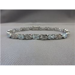 Stunning Blue Topaz & Diamond tennis bracelet