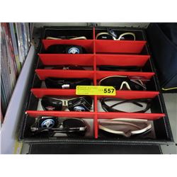 9 New pairs of sunglasses in display case
