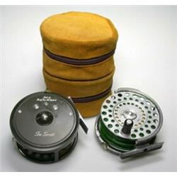 A Hardy Zenith wide spool trout fly reel, 33/8" together with another older with sawn away rim, in..