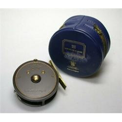 A Hardy Featherweight trout reel with brown finish and brass fittings, 23/4", in blue Hardy zip cas.