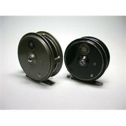 A J. W. Young Pridex narrow drum trout fly reel, grey finish, 31/8" and another with black finish,..