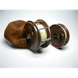 A Milward Flyranger FWD wide drum salmon fly reel, brown finish, 4", in brown suede bag; and a Milw.