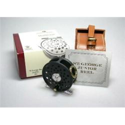 A Hardy St George Junior trout reel, 23/8", in Hardy leather case and original card box...