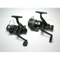 Daiwa Auto 1657DM fixed spool reel and two spare spools, boxed and an Okuma FS611 fixed spool reel..