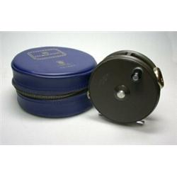 A Hardy Perfect trout reel, 33/8" in blue Hardy zip case...