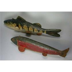 Two wooden decoys carved as fish (possibly American), 31cm and 25cm respectively, both painted and..