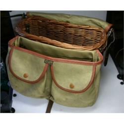 A modern wicker creel with attached canvas pockets, by Brady...