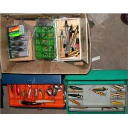 A box containing a large quantity of plugs, lures and other baits and two plastic carry cases with..