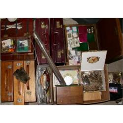 A large quantity of fly tying materials including, capes, pheasant tails contained in five wooden c.