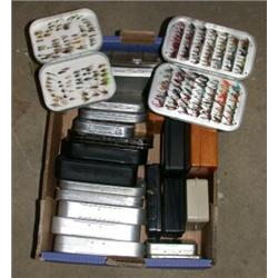 Twelve Wheatley type alloy fly tins, and eleven other plastic and wooden fly boxes containing trout.